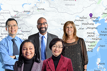 SP2 faculty and staff in front of a map of China