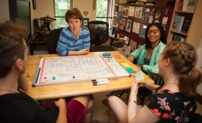 Amy Hillier working with SexGen Policy Lab interns to test out a board game that models how to discuss gender.