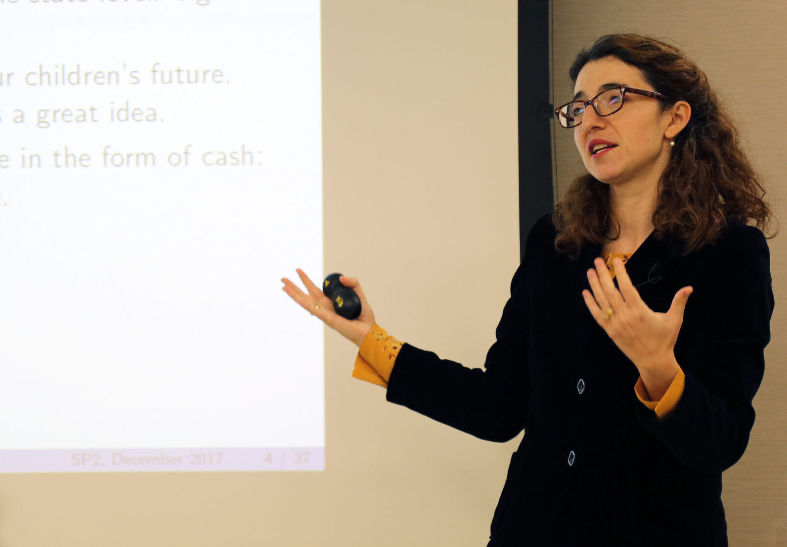 Dr. Ioana Marinescu speaking about universal basic income at an SP2 event.