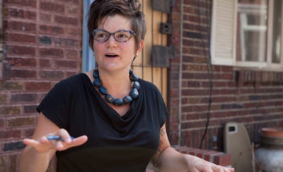 Image of Amy Castro Baker walking in South Philadelphia
