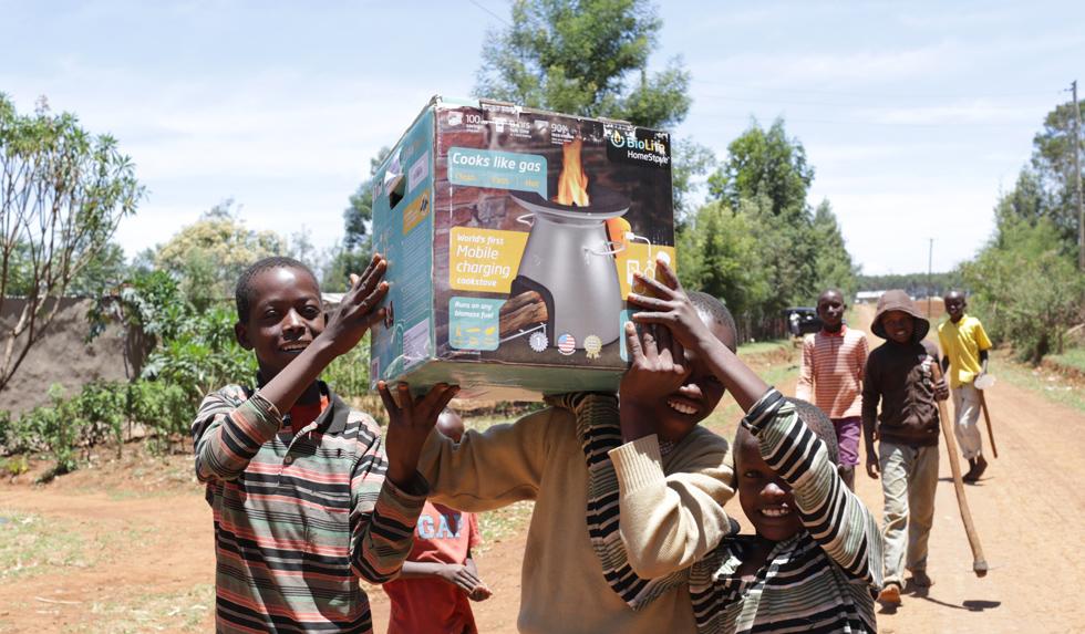 Children in Kenya holding up a BioLite stove