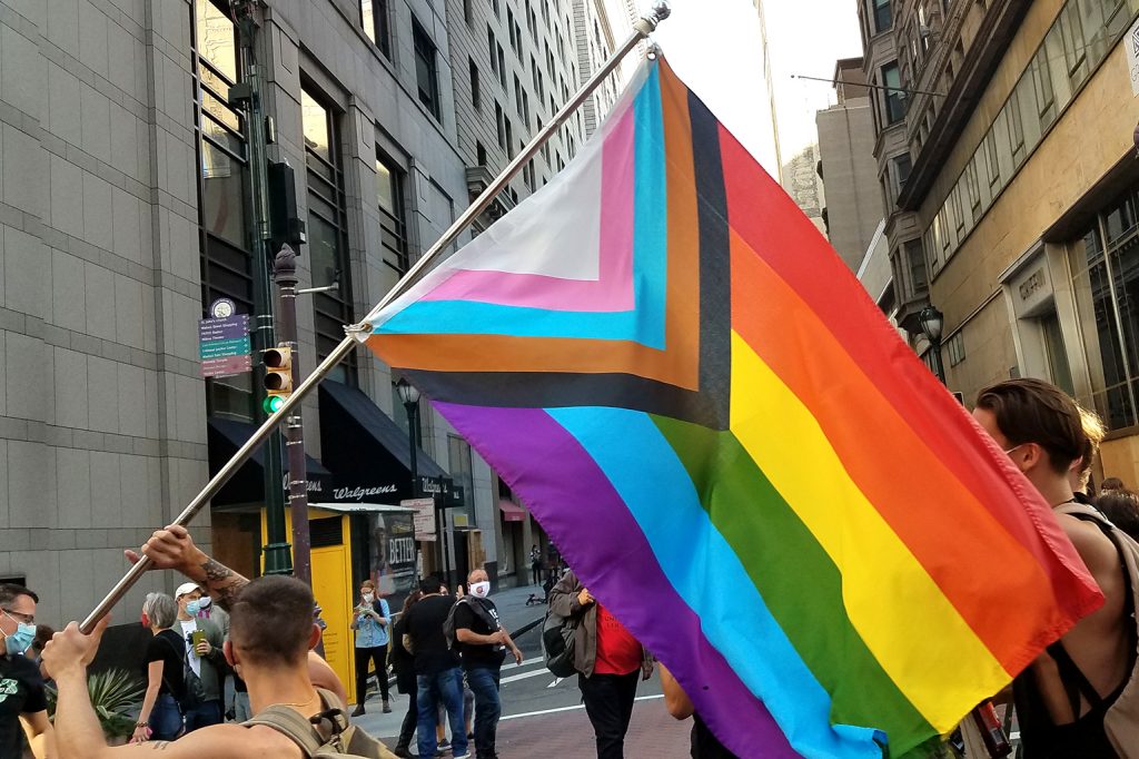 Philadelphians celebrate the outcome of 2020’s presidential election, waving the Progress Pride Flag while marching through Center City.