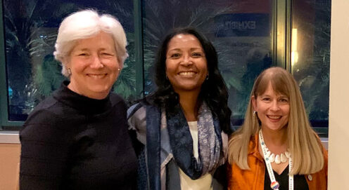 Dean Bachman and Drs. Tamara Cadet and Barbara Jones stand together smiling.